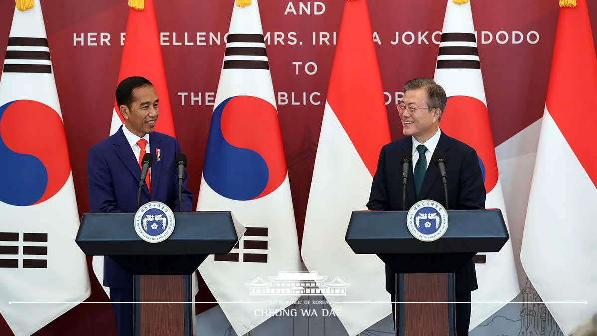 Holding a joint press conference with President Joko Widodo of Indonesia