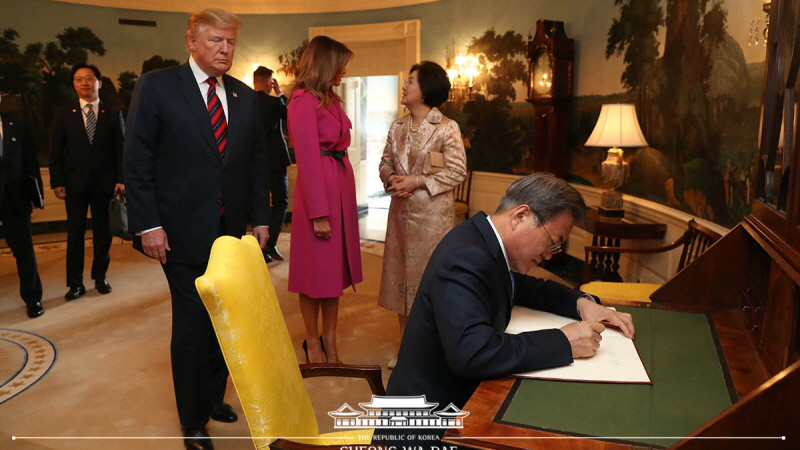 Being welcomed by U.S. President Donald Trump and signing the White House guestbook