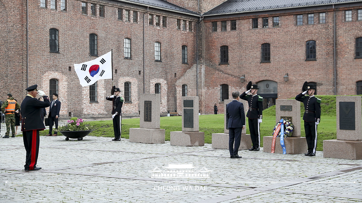 Laying a wreath at the Korean War veterans memorial at Akershus Fortress in Oslo, Norway