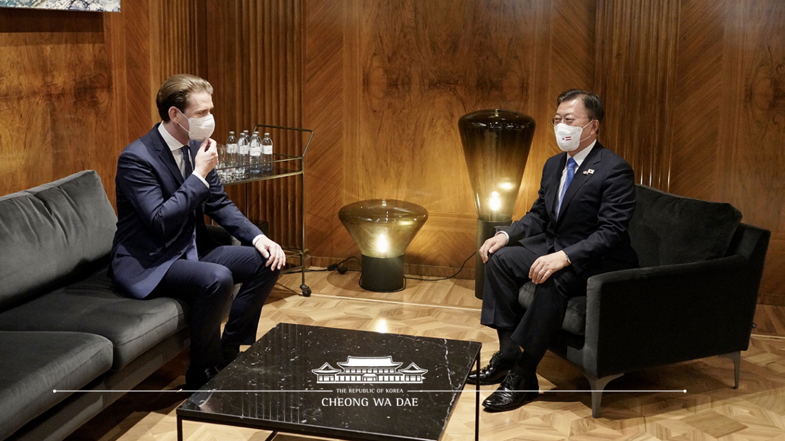 Being greeted by Chancellor Kurz of Austria and having a brief conversation before their bilateral talks at the Federal Chancellery in Vienna