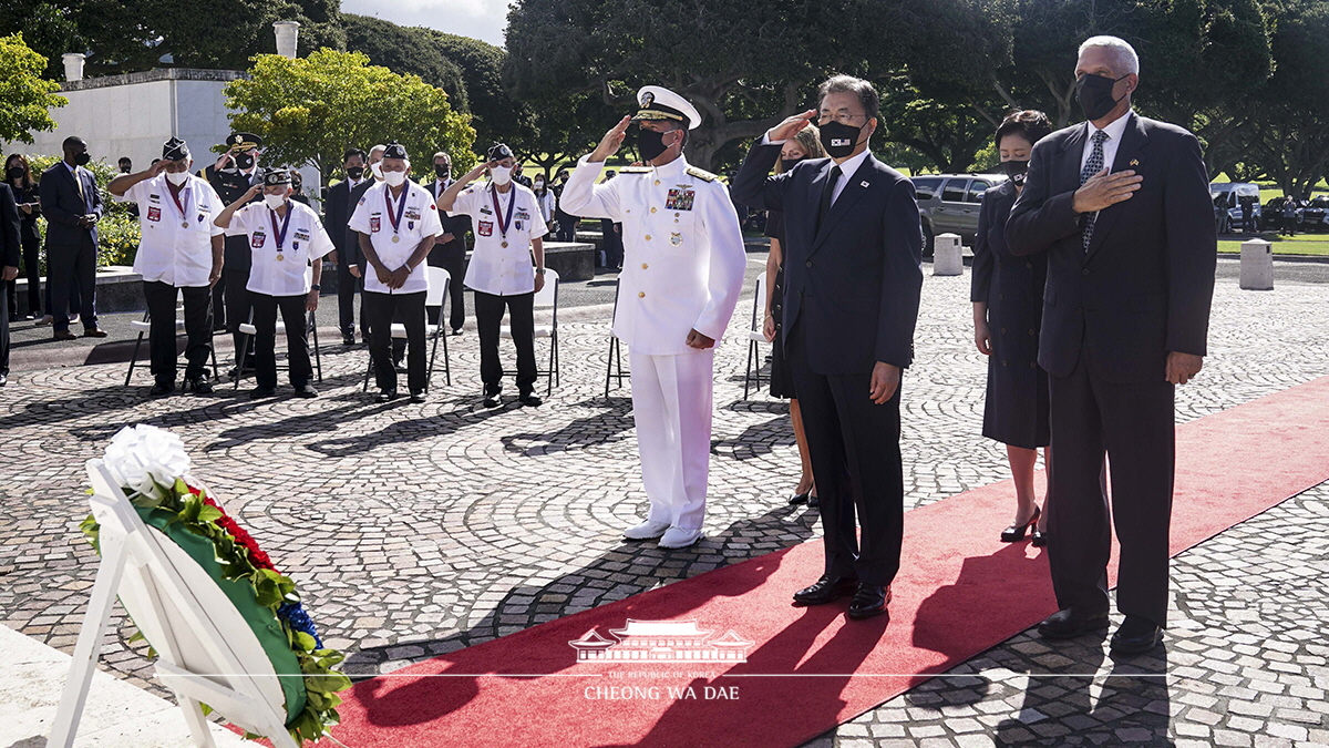 Laying a wreath at the National Memorial Cemetery of the Pacific in Honolulu, Hawaii