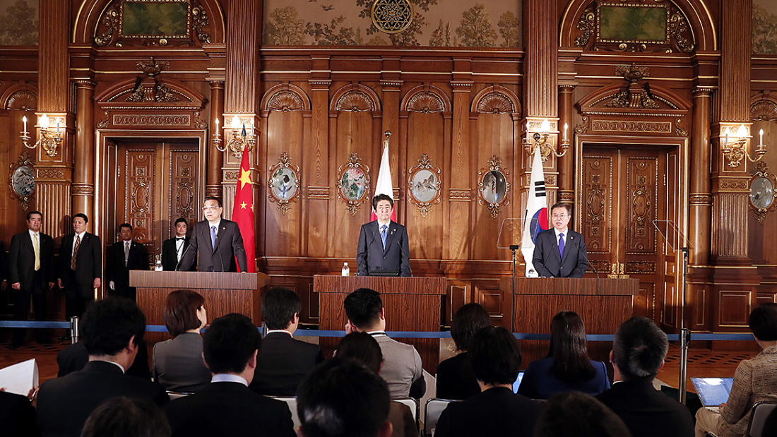 Attending a joint press conference following the 7th  Korea-Japan-China Summit