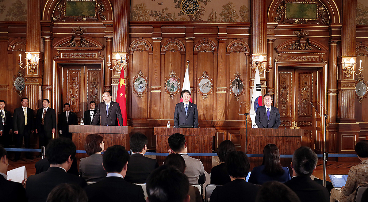 Attending a joint press conference following the 7th  Korea-Japan-China Summit