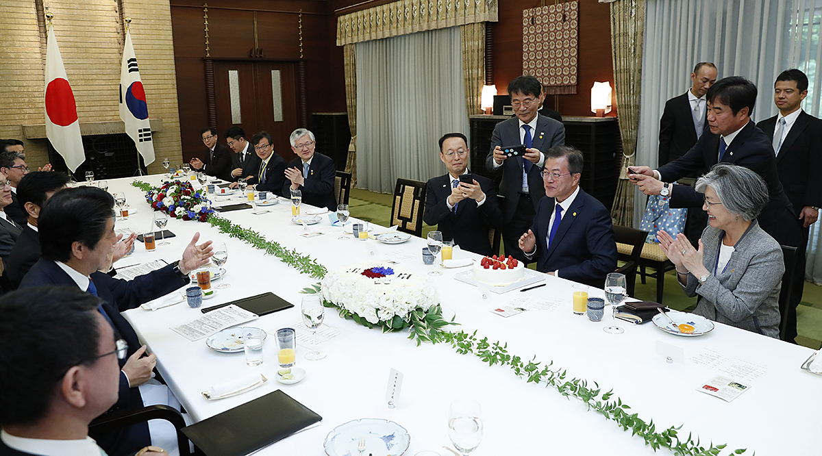 Attending a luncheon with Japanese Prime Minister Shinzon Abe 