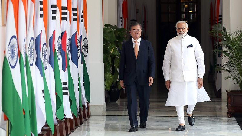 Walking with Indian Prime Minister Narendra Modi before attending a one-on-one summit