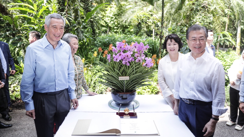 Attending a christening ceremony for an orchid named in the First Couple’s honor in Singapore