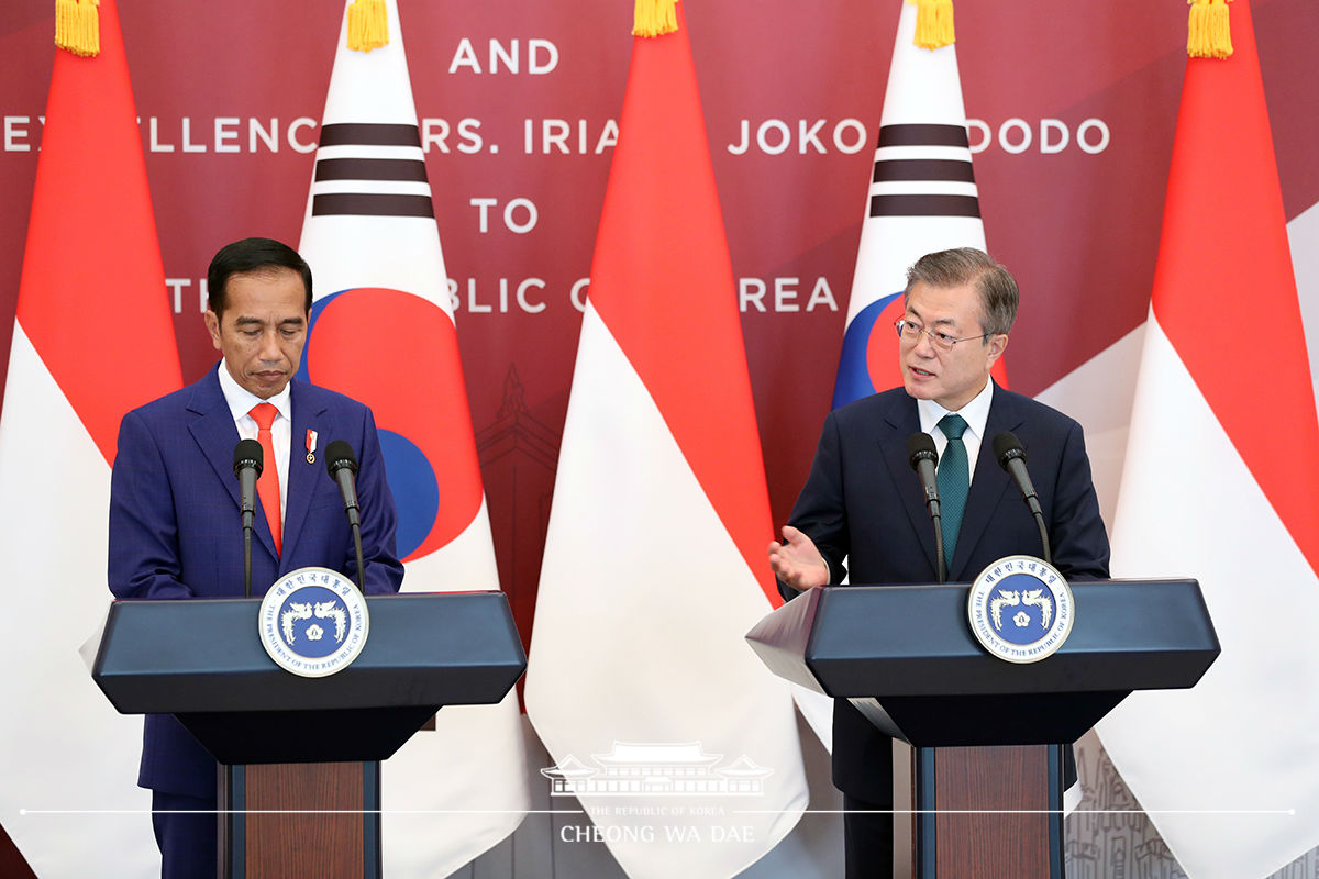 Holding a joint press conference with President Joko Widodo of Indonesia 