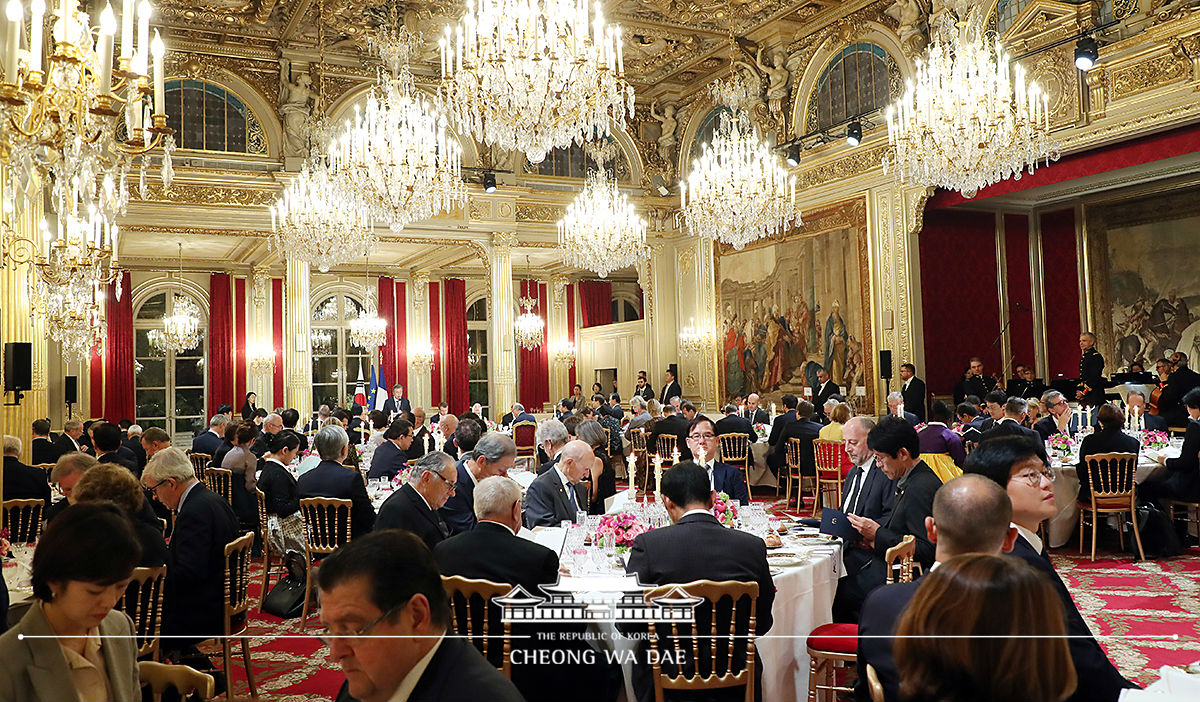 Attending a state dinner hosted by President Emmanuel Macron 