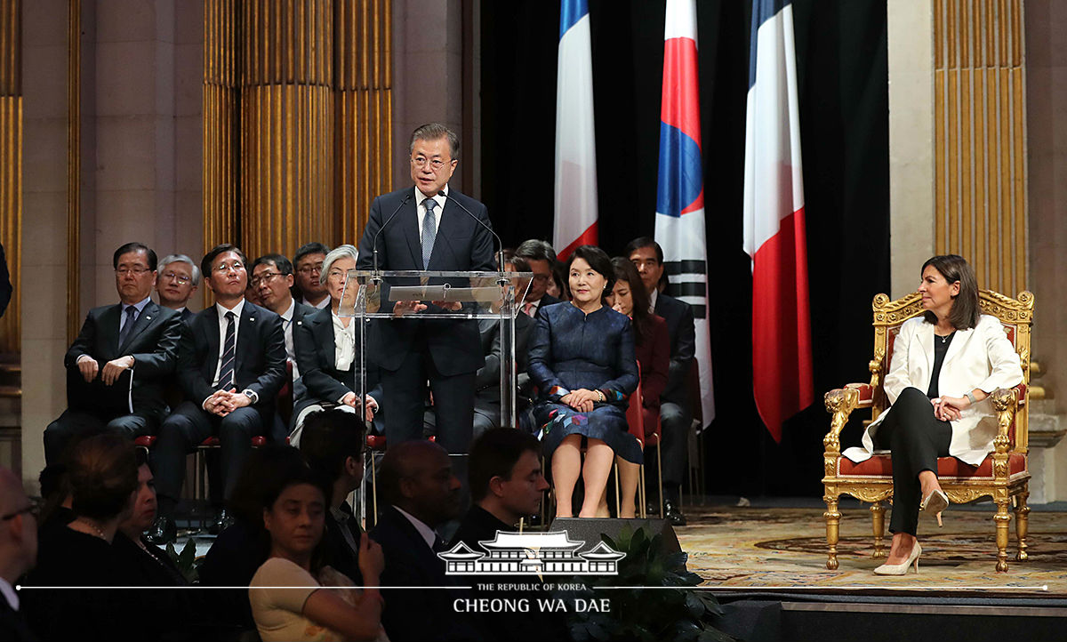 Attending a welcoming reception at the City Hall of Paris 