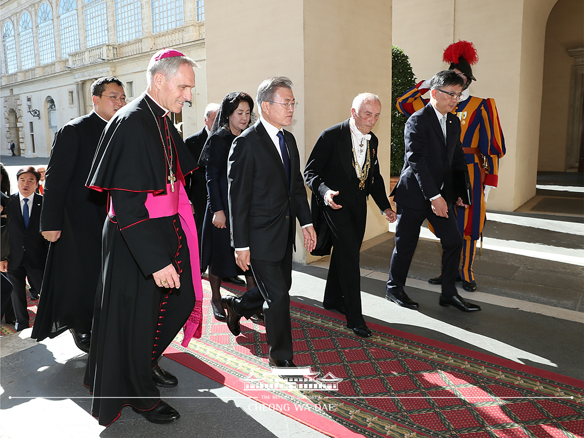 Attending a welcoming ceremony at the Apostolic Palace of the Vatican 