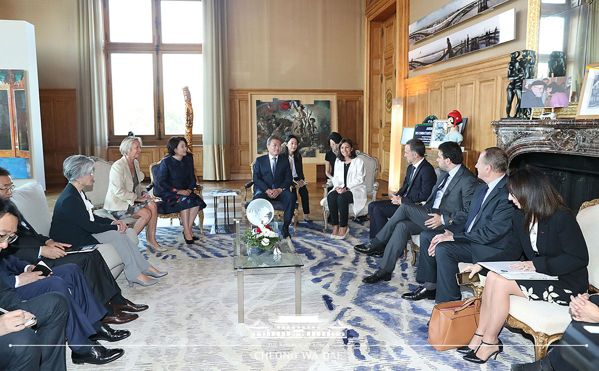 Attending a welcoming reception at the City Hall of Paris 