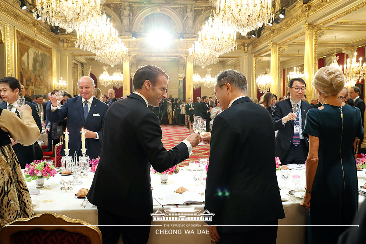 Attending a state dinner hosted by President Emmanuel Macron 