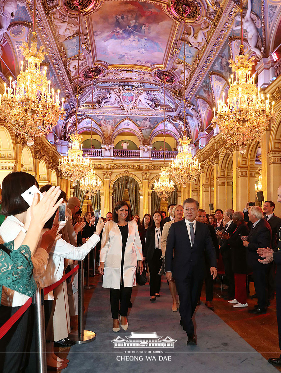 Attending a welcoming reception at the City Hall of Paris 