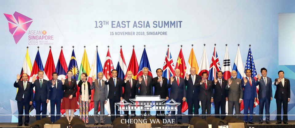 Posing for a group photo at the 13th East Asia Summit held in Singapore 