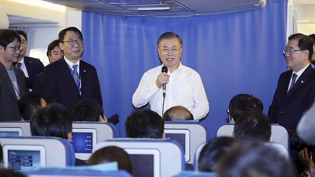 President Moon Jae-in on Dec. 1 answers questions from journalists during a news briefing inside the presidential plane while flying to New Zealand from Argentina after attending the G20 Leaders’ Summit.