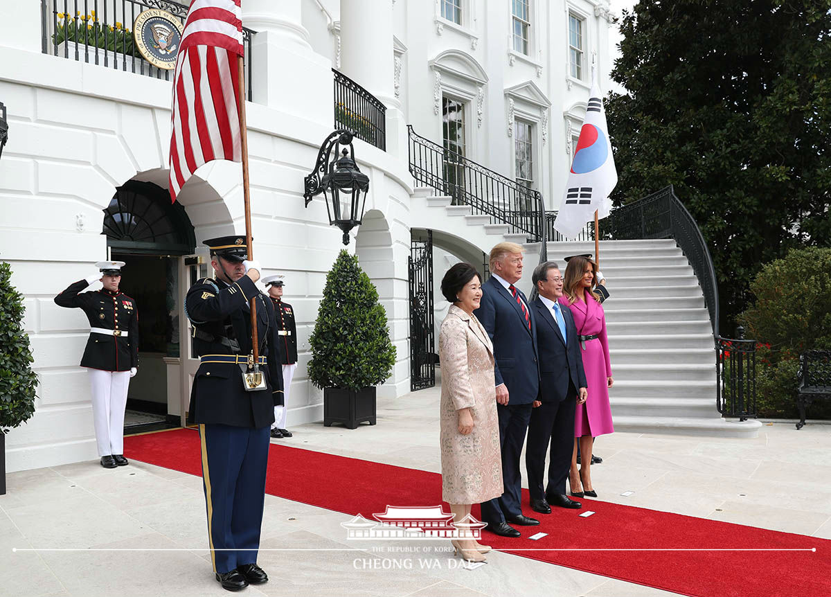 Being welcomed by U.S. President Donald Trump and signing the White House guestbook 