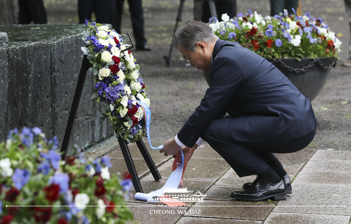 Laying a wreath at the national monument for World War II victims at Akershus Fortress in Oslo, Norway