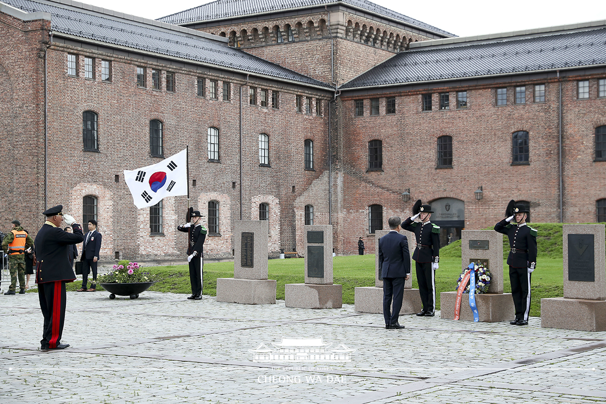 Laying a wreath at the Korean War veterans memorial at Akershus Fortress in Oslo, Norway