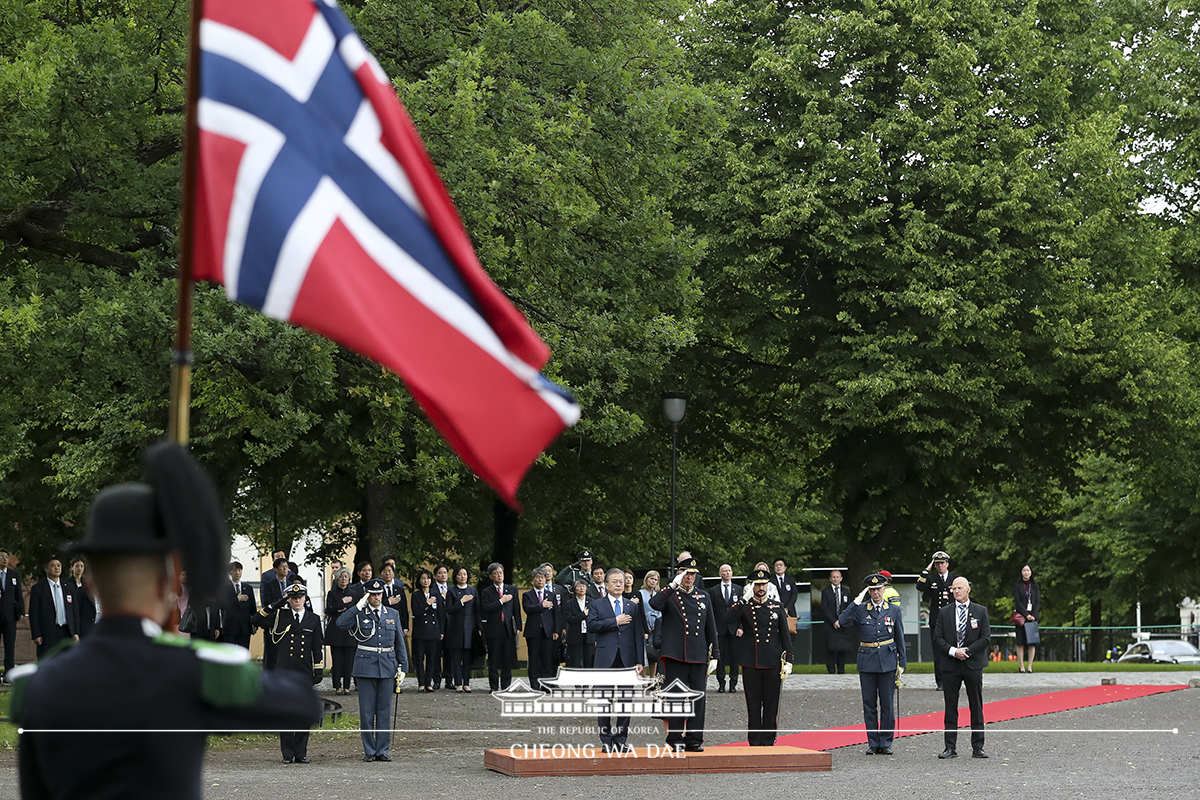 Laying a wreath at the national monument for World War II victims at Akershus Fortress in Oslo, Norway