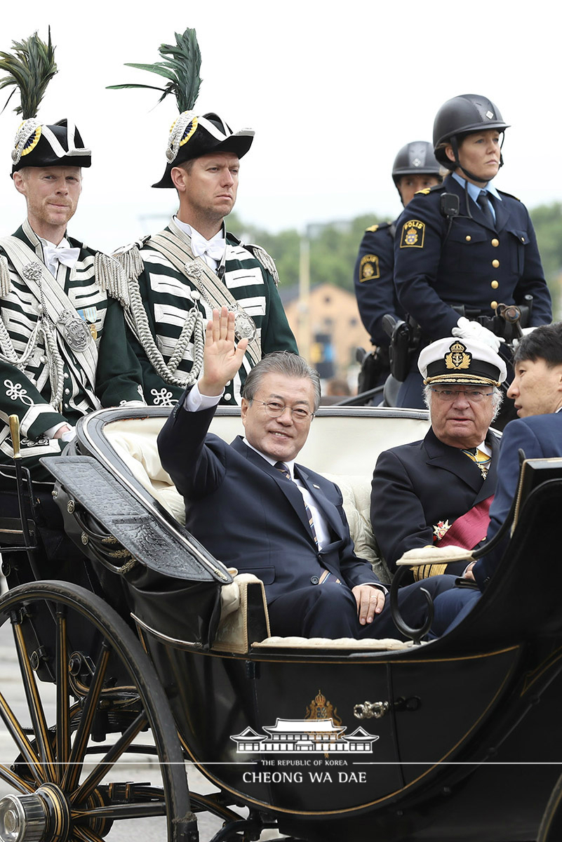 Taking a carriage ride to reach the Royal Palace for the official welcoming ceremony in Stockholm, Sweden