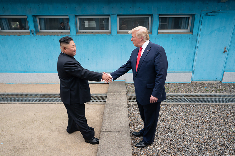 U.S. President Donald Trump and North Korean leader Kim Jong Un on June 30 perform a symbolic handshake at the Military Demarcation Line between the two Koreas. (The White House)