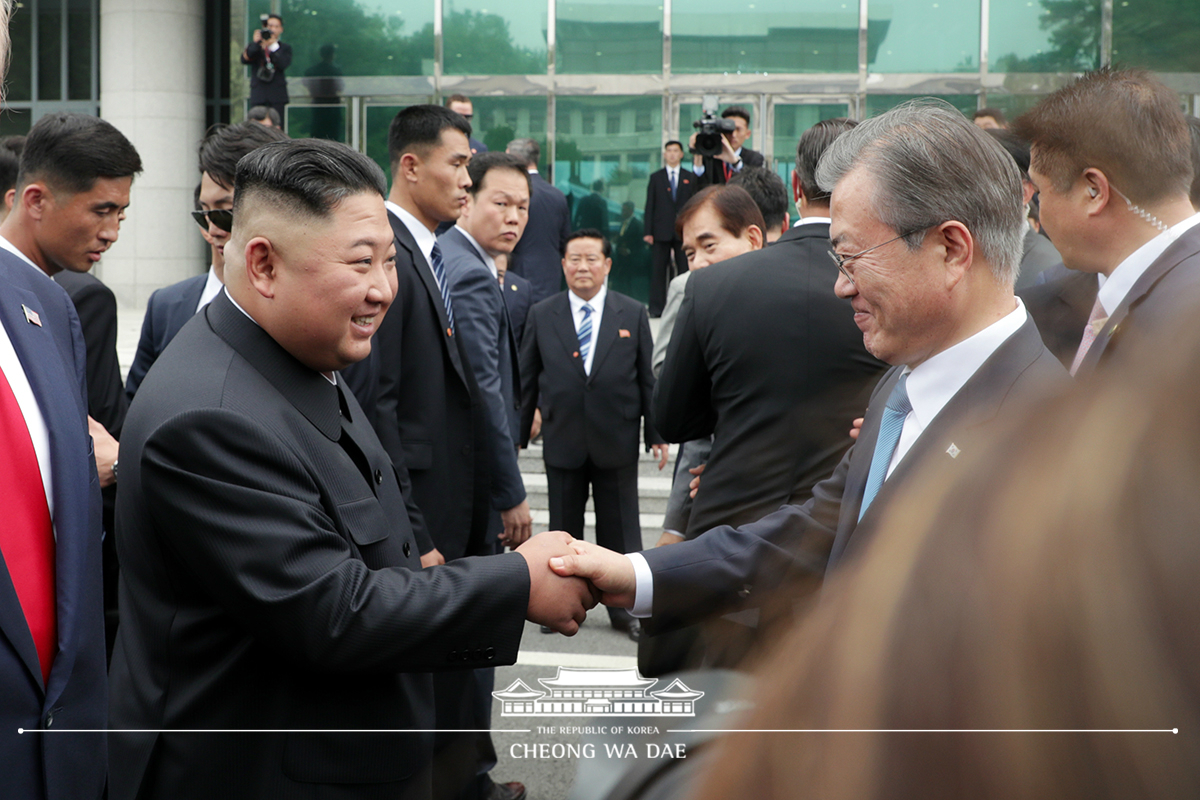 Leaders of the two Koreas and the United States meeting together for the first time in Panmunjeom