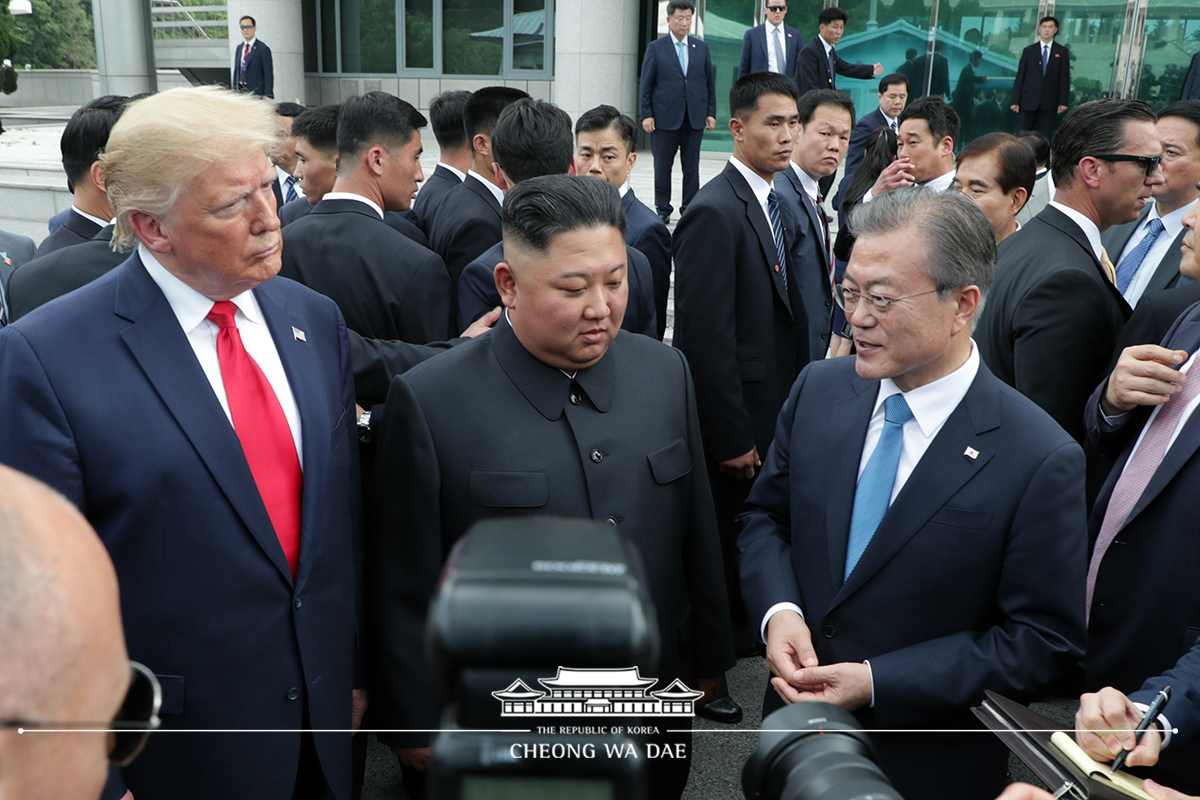 Leaders of the two Koreas and the United States meeting together for the first time in Panmunjeom