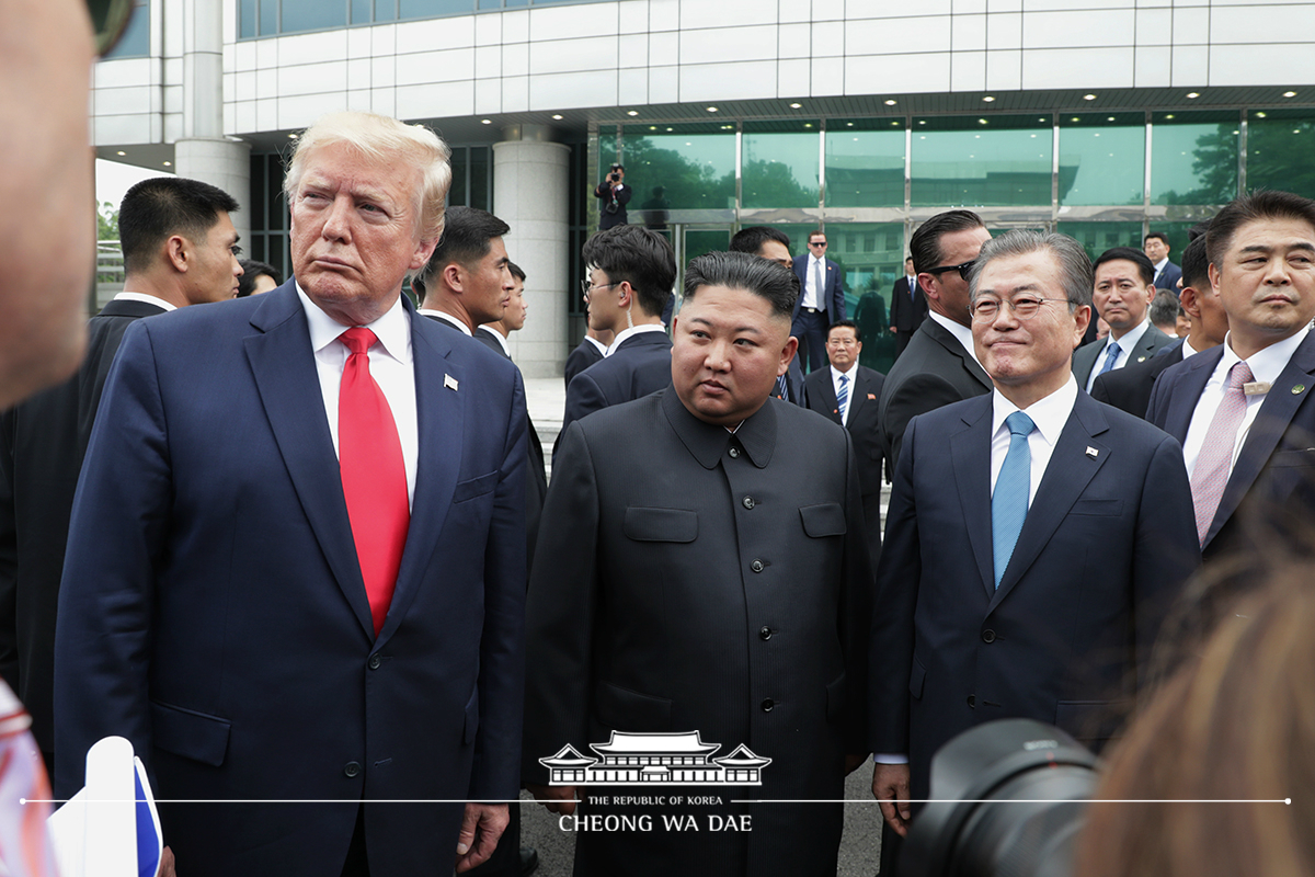 Leaders of the two Koreas and the United States meeting together for the first time in Panmunjeom