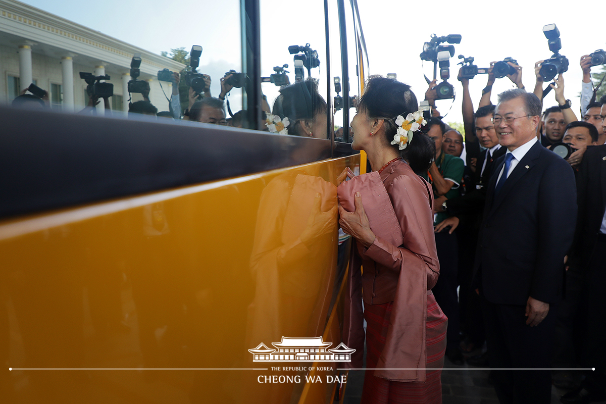 Attending a ceremony to mark the delivery of donated school buses for students in Myanmar 