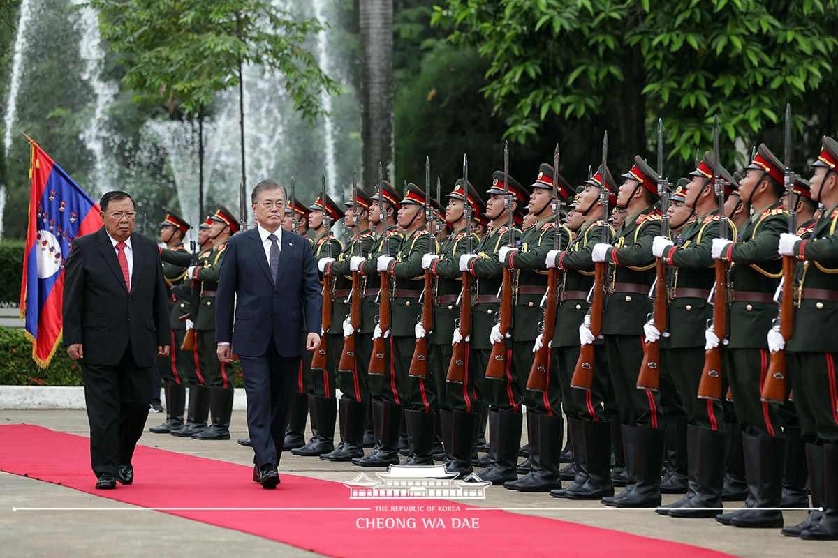 Attending the official welcoming ceremony at the Presidential Palace in Vientiane, Laos