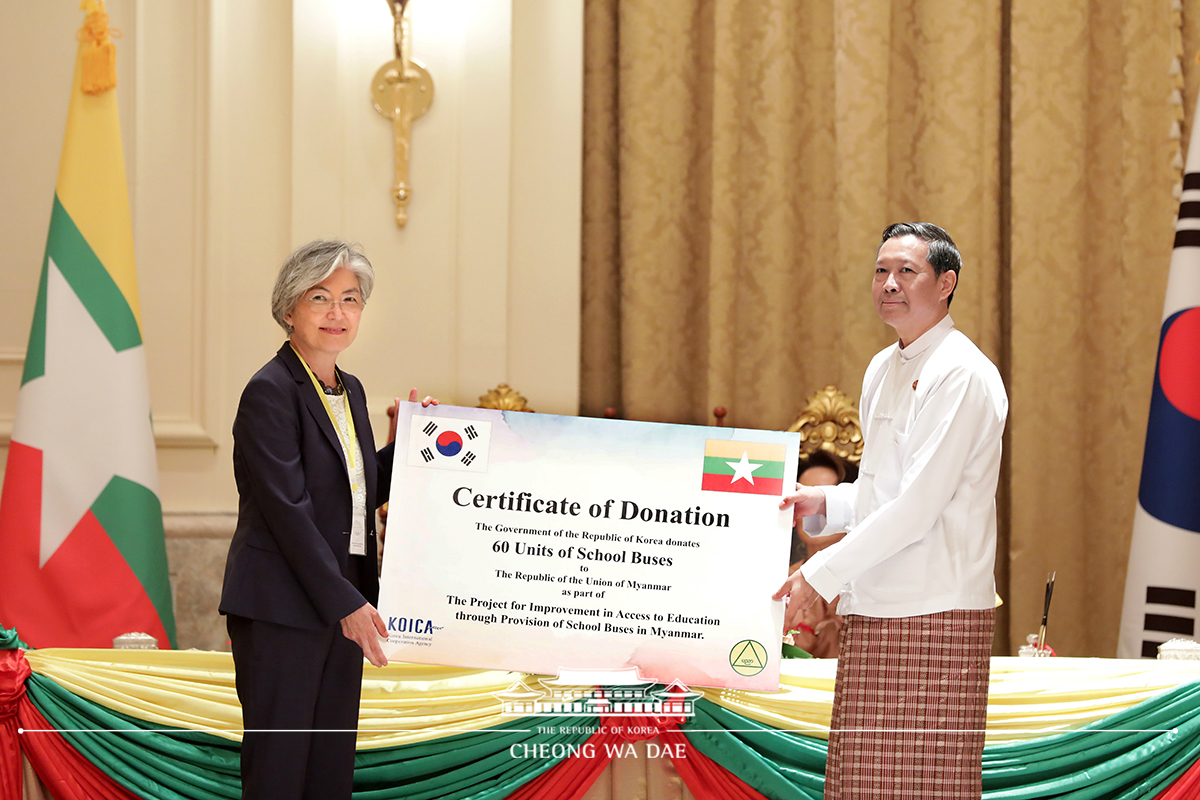 Attending a ceremony to mark the delivery of donated school buses for students in Myanmar 