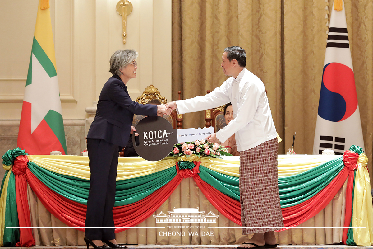 Attending a ceremony to mark the delivery of donated school buses for students in Myanmar 