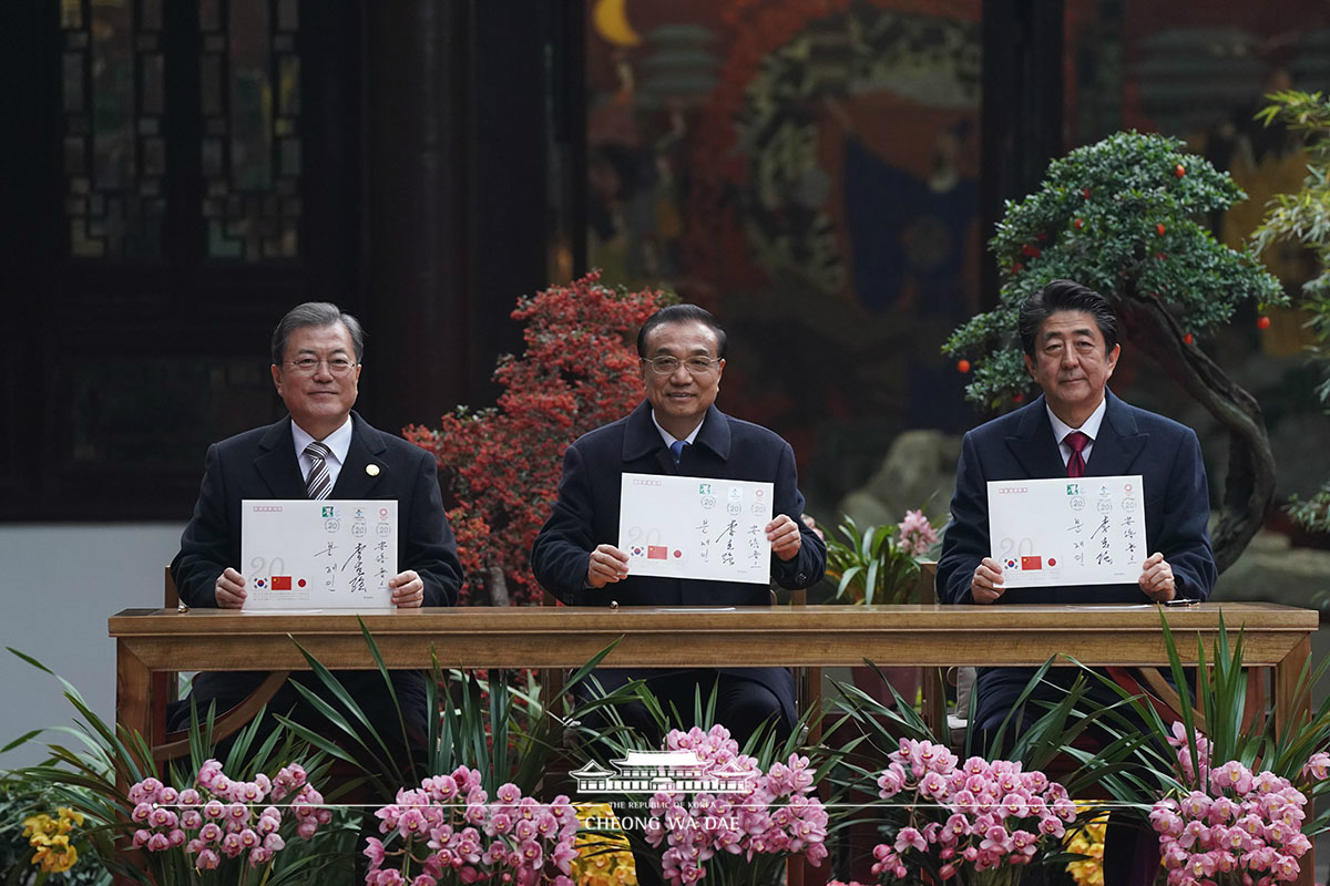 Attending an event with the Chinese Premier and Japanese Prime Minister to celebrate the 20th anniversary of trilateral cooperation 