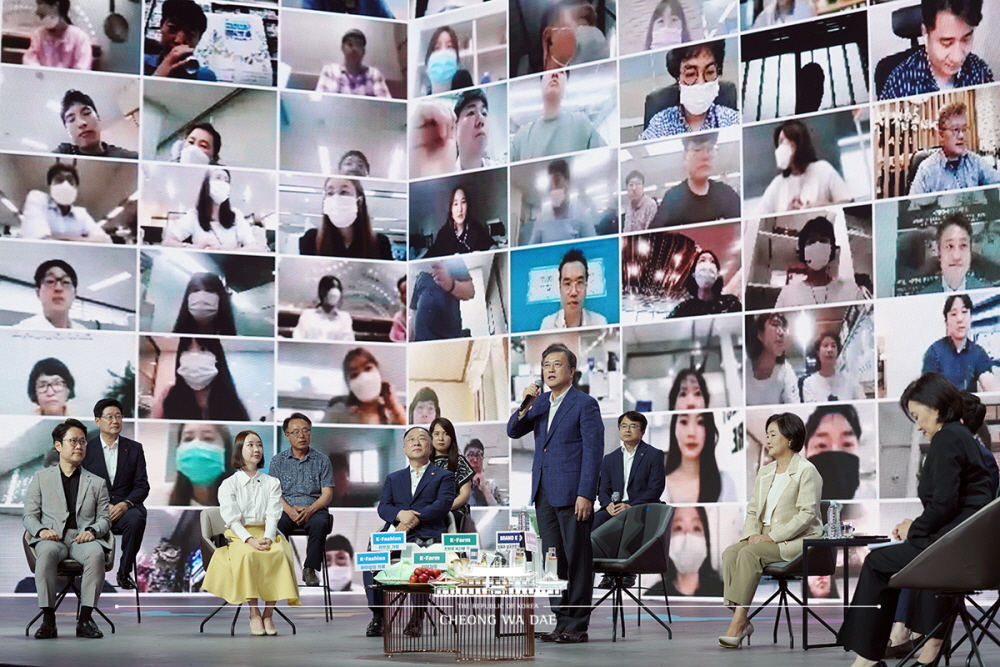 President Moon Jae-in on July 2 speaks to vendors watching nationwide at an event for the massive Korea All-together Sale at Seoul's Olympic Gymnastics Stadium. 