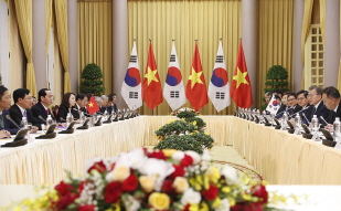 Attending a summit with President of Vietnam Tran Dai Quang