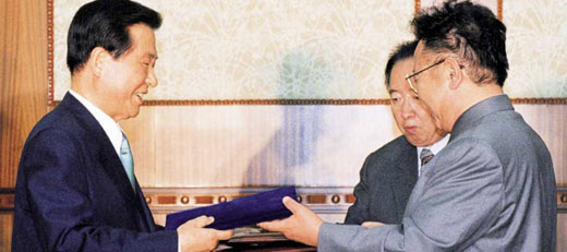 President Kim Dae-jung (left) and Chairman Kim Jong Il exchange copies of the South-North Joint Declaration, in Pyeongyang in 2000.